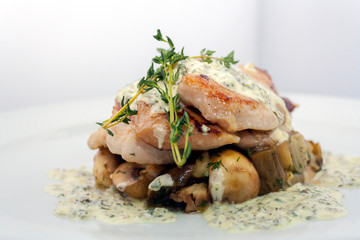 fried pork with mushrooms, potatoes, rosemary and tartar sauce on a white background isolated