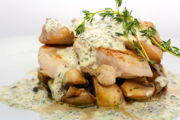 fried pork with mushrooms, potatoes, rosemary and tartar sauce on a white background isolated