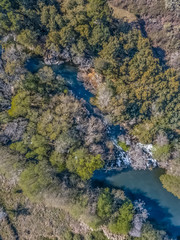 Fototapeta na wymiar Aerial view of drone, natural landscape river with and colored trees on the banks