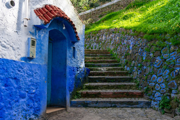 Stone Stairs up a Hill next to a Blue Cottage in Chefchaouen Morocco