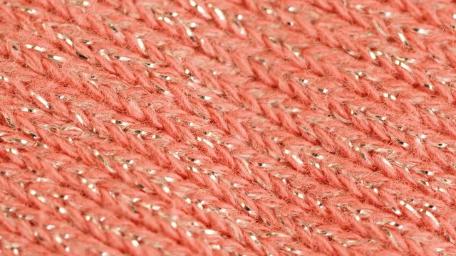 Pink pastel fabric rotating. 4K macro footage.