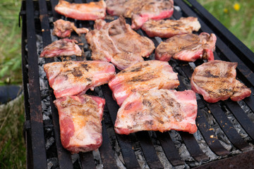 Ribs ans steak on the grill closeup 