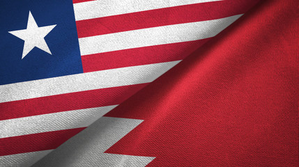 Liberia and Bahrain two flags textile cloth, fabric texture 
