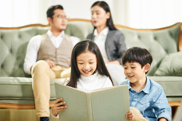 Fototapeta premium two asian children reading book together