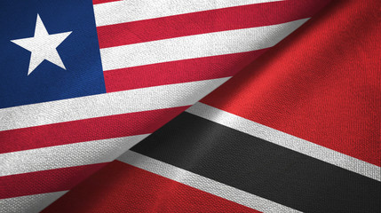 Fototapeta premium Liberia and Trinidad and Tobago two flags textile cloth, fabric texture