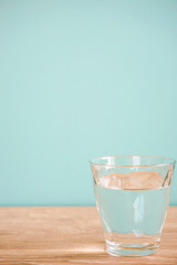 Glass of water on the table.  テーブルの上のグラス一杯の水