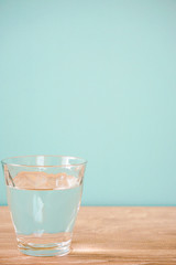 Glass of water on the table.  テーブルの上のグラス一杯の水