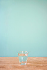 Glass of water on the table.  テーブルの上のグラス一杯の水