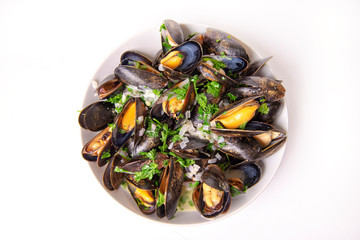 Plate of fresh mussels with onion and parsley mignonette