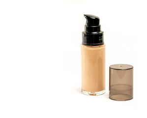 Cosmetic Foundation Bottle with Its Cap Open Beside It on White Backgound and Copy Space for Text...