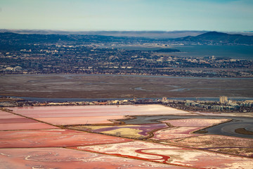 Pink, Red, and Orange Colors Shimmer in the Palo Alto-Salt Ponds in the Silicon Valley Area in...