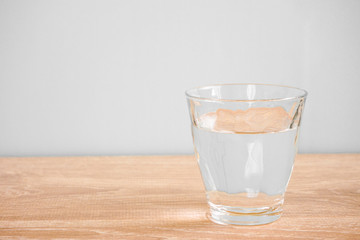 Glass of water on the table. テーブルの上のグラス一杯の水