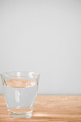 Glass of water on the table. テーブルの上のグラス一杯の水