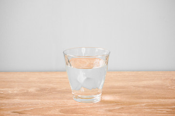 Glass of water on the table. テーブルの上のグラス一杯の水