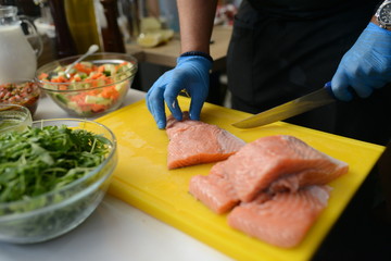 Making dinner at restaurant. Proffesional cooker