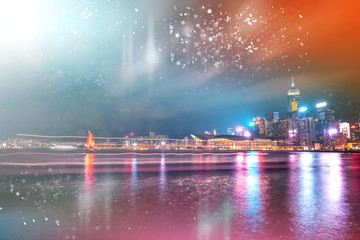 Abstract colorful circular bokeh with city background. Double exposure