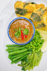 Chilli sauce of catfish eaten with vegetables and thai basil omelet (Thai cuisine)