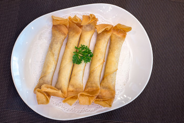 crispy spring roll on white plate