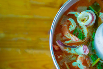 Tom Yum Goong,spicy prawn soup Thai Food on wood