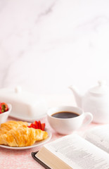 A Personal Bible Study at a Table Set for Breakfast