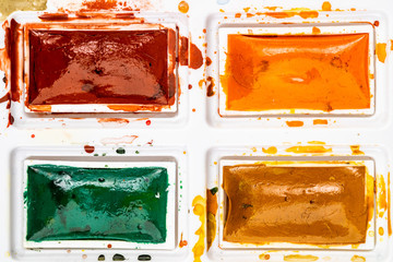 Set watercolor paints with paintbrush. Art concept