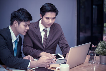 Business group or business partners discussing documents and ideas at meeting