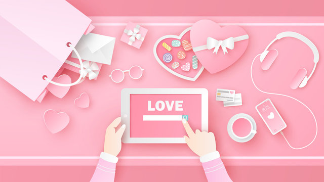 Women are searching for Love on tablet in Valentine's day with decorated items and accessories in pink set on desk. Desk design of Love. paper cut and craft style. vector, illustration.