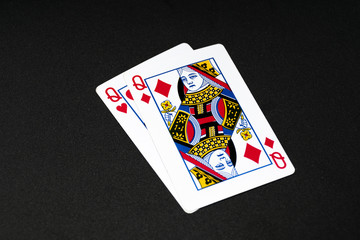 Queen of Diamonds Card on Top of Queen of Heart Card