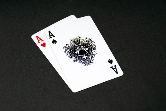 Ace of Spades on top of the Ace of Hearts