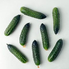 Fresh cucumbers on light background, organic nutrition food, vegan healthy minimal background
