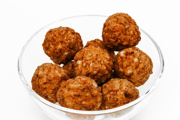 Roasted meatballs in a glass bowl