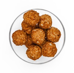 Roasted meatballs in a glass bowl