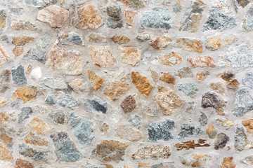 Old rough stone wall. Rock gray background.