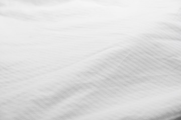 White delicate soft background of fabric or bedding sheet