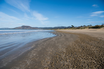 Fototapeta na wymiar Waves at Five Mile beach, Tasmania