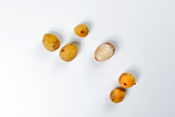 Lansium parasiticum langsat lanzones on white background