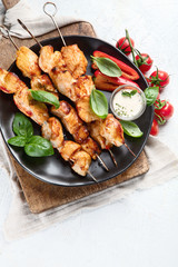 Grilled chicken on skewers. Top view with copy space