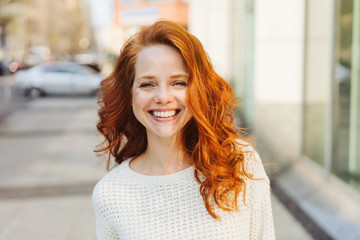 Happy friendly attractive young woman