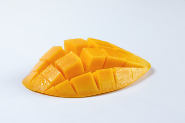 ripe yellow mango cut slice whole on white background