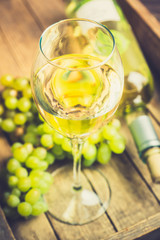 White wine on the rustic background. Selective focus. Shallow depth of field.