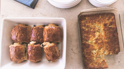 Brunch appetizers laying on a white granite counter top with warm natural light filtering in