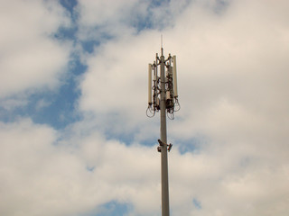 A cell site, tower, or cellular base station  - enabled mobile device site where antennae and...