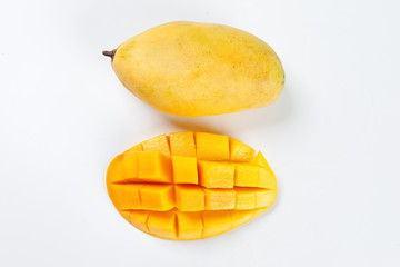 ripe yellow mango cut slice whole on white background