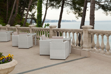 street cafe interior with rattan furniture