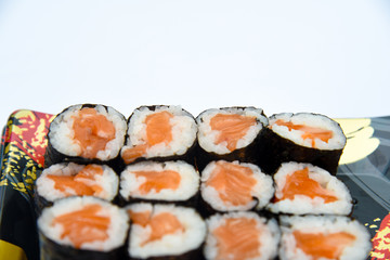 Sushi Roll with salmon on the white background .Food abstract background