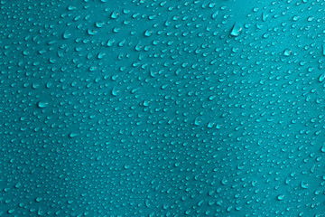 Water drops on blue background. Abstarct blue wet texture.
