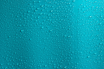 Water drops on blue background. Abstarct blue wet texture.