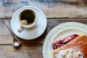 Cup of coffee on brown wooden table