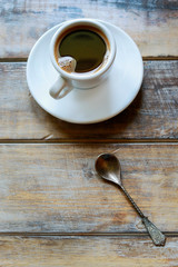 Cup of coffee on brown wooden table