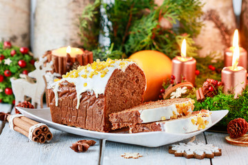 Christmas gingerbread cake among traditional decorations.